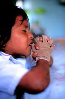 A young girl praying
