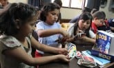 children playing card game