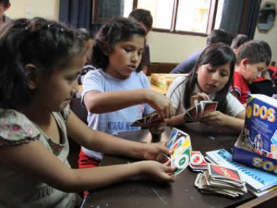 children playing card game