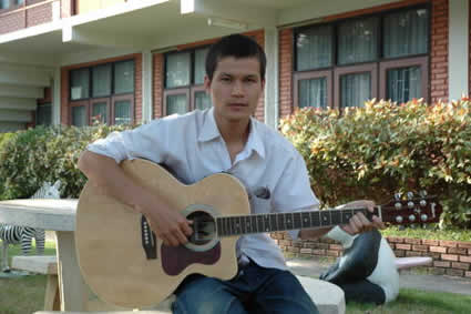 young man playing guitar