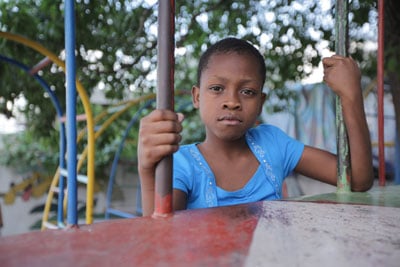 girl on playground equipment