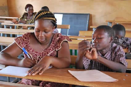 students writing letters at desks