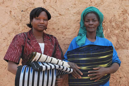 two women holding fabric