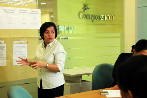 Filipino woman making a presentation in an office