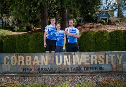 three students behind college sign