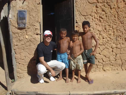 young man with three shirtless boys