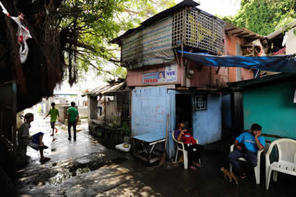 people sitting outside of their home