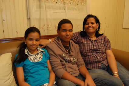 woman sitting with young man and girl