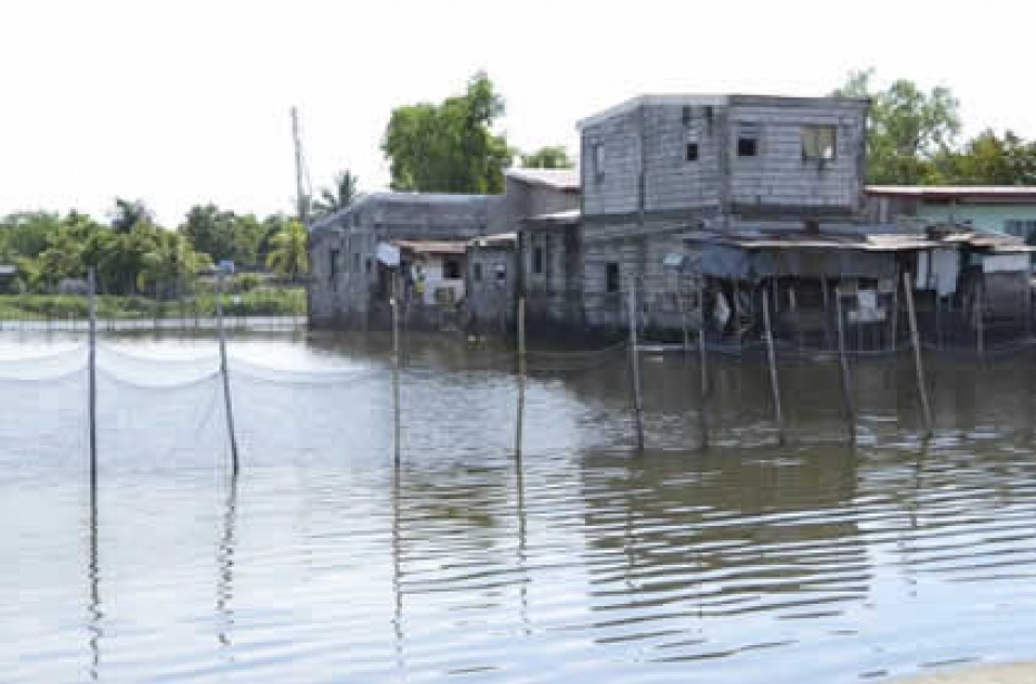 building with metal siding at water's edge