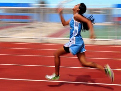 girl running down track
