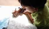 Young child coloring.