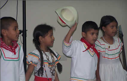 four Honduran children in traditional costumes