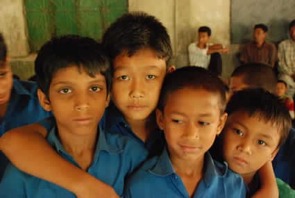 four boys posing for photo