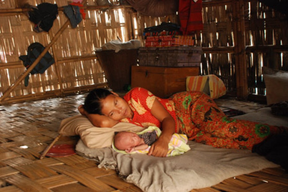 mother and baby on floor of home