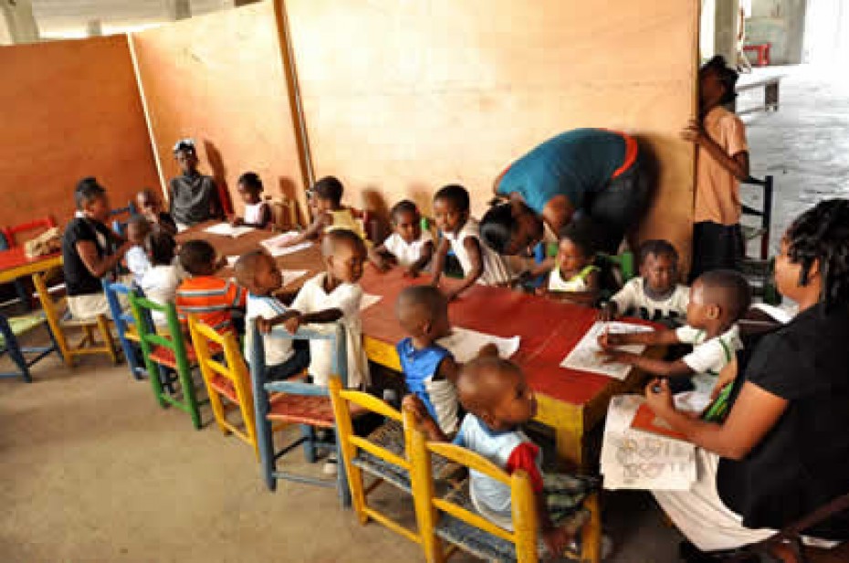 group of young children sitting around table