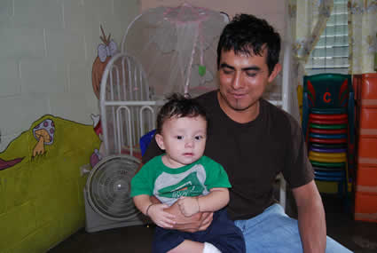 man holding baby in his lap