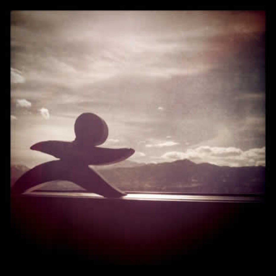Skippy_August-13 Compassion figurine in front of a window