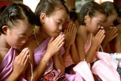 Thai girls praying
