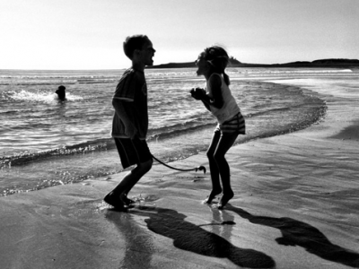 two children playing at the beach