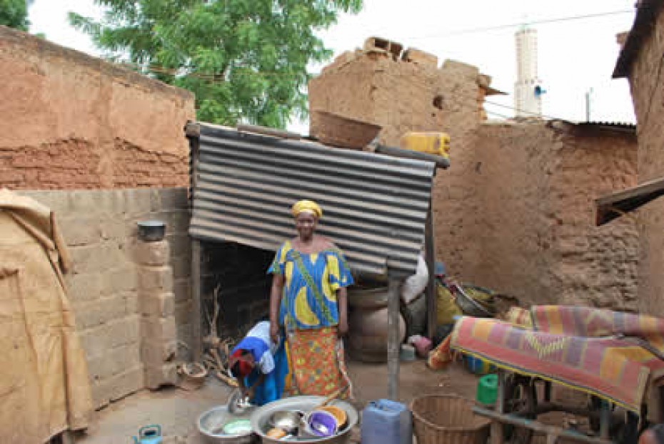 woman washing dishes outside