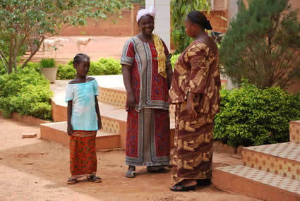 two women and a girl talking