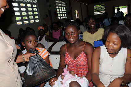 group of smiling women inside a building