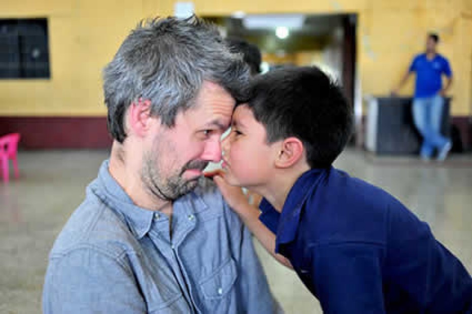 Shaun Groves in a staring contest with a young boy