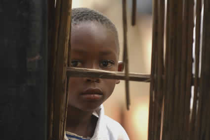 boy looking through an opening