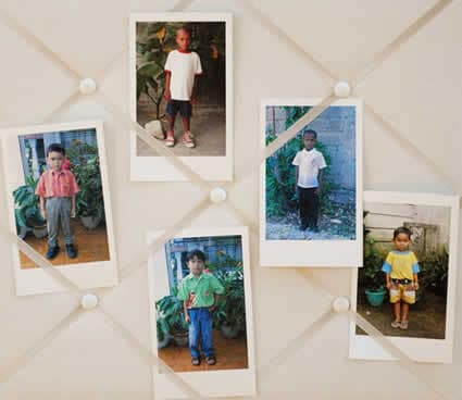 photos of children on display board