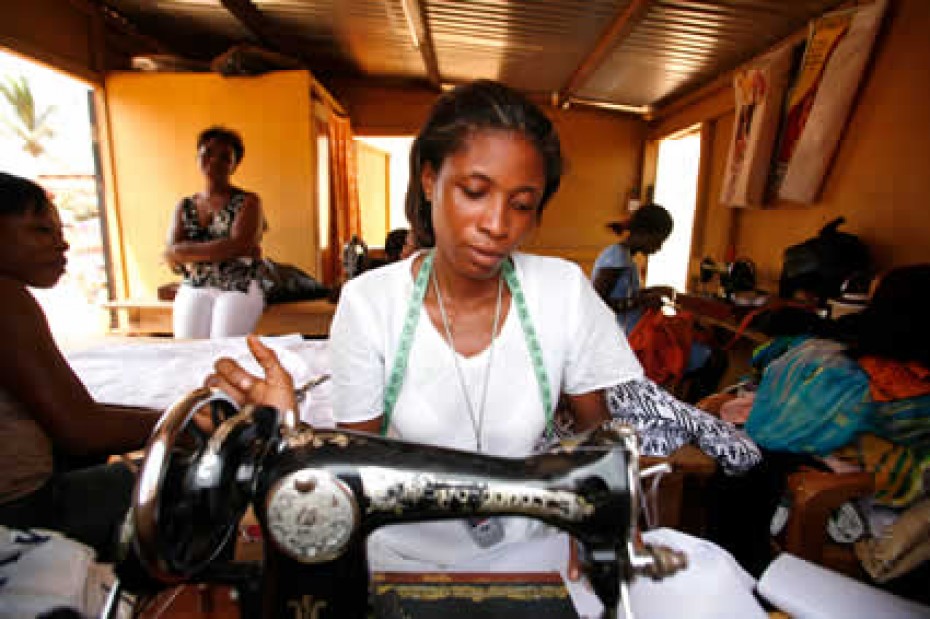 woman using sewing machine