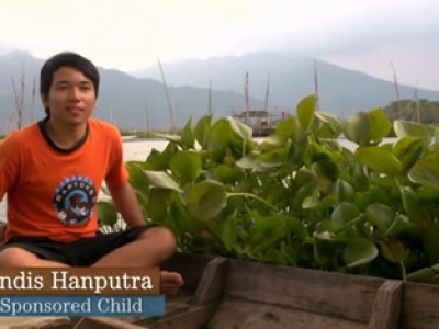 A boy sitting with his legs crossed