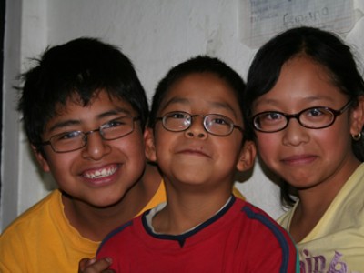 Three children smiling.