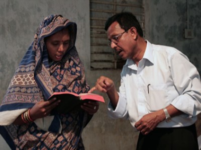 Man and woman looking at a book