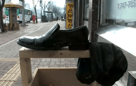 shoe sitting on shoeshine stand
