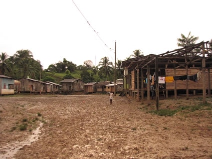 dirt road leading to village of homes