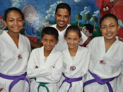 group of children in taekwondo uniforms
