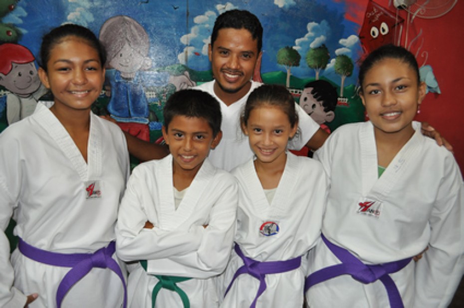 group of children in taekwondo uniforms