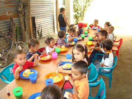 children at a table having a meal