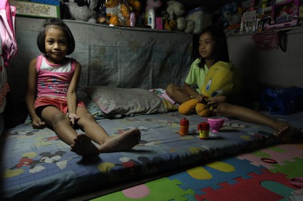 two girls sitting on floor