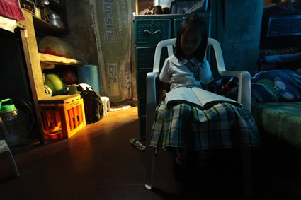 girl reading inside home