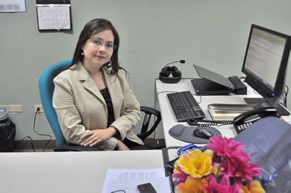 Yolanda Rodas sitting at desk