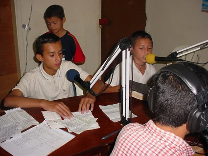 children speaking into microphones