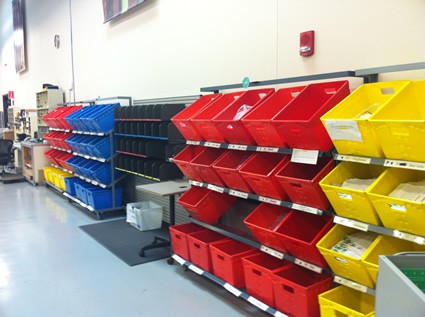 colorful bins on shelves along the wall