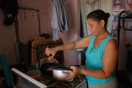 woman cooking on stove
