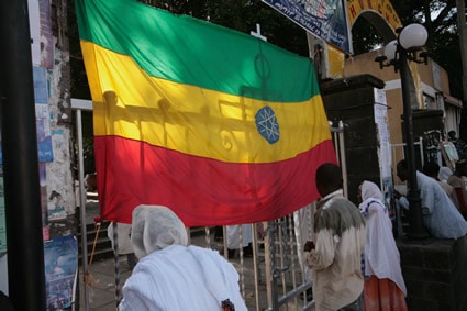 people standing by an Ethiopian flag