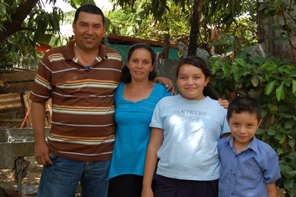 family standing together outside