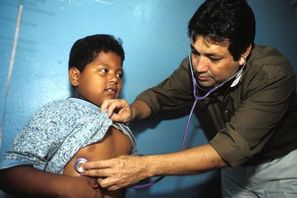 young child receiving medical checkup from a doctor