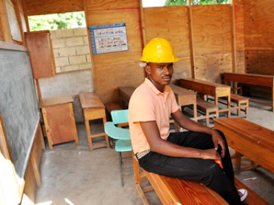Haitian man wearing construction helmet