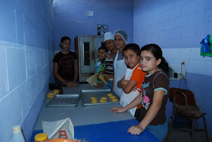 young people working in a bakery kitchen