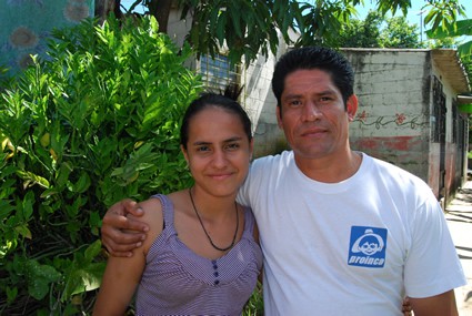 man with arm around woman